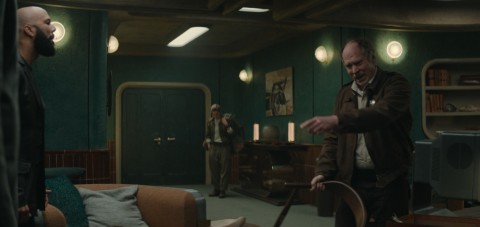 An angry Deputy Marnes with a shrinking Jules in the background in Silo Episode 4