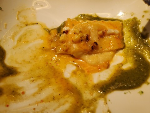 Inside the Corn Ravioli, Roasted Tomatillos, Cilantro with espelette sauce at Le Jardinier at Miami's Design District