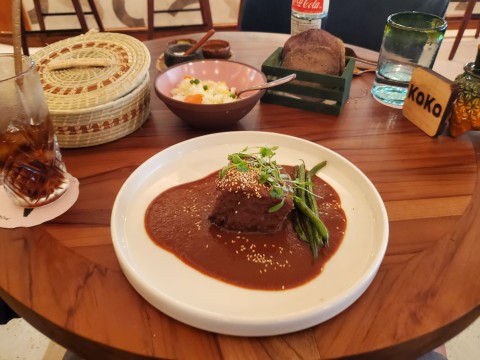 Mole Coloradito Short Rib with sesame seeds, string beans and house rice at Koko in Coconut Grove