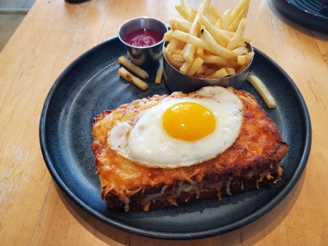 Croque Madame, ham and gruyere on toasted bread with sunny side up egg