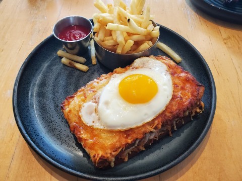 Croque Madame, ham and gruyere on toasted bread with sunny side up egg