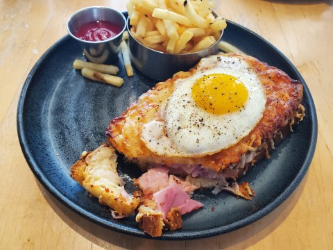 Croque Madame, ham and gruyere on toasted bread with sunny side up egg