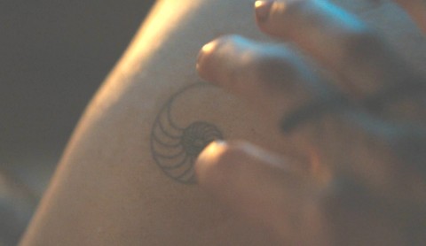 Tattoo of seashell on George Wilkins