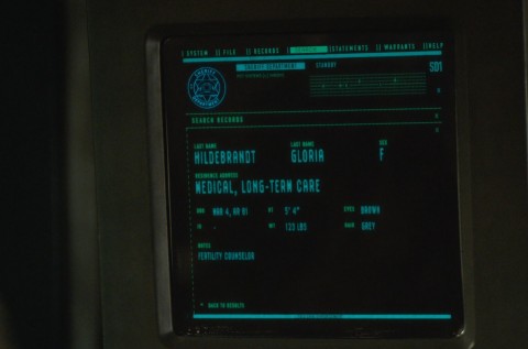 Computer display showing Gloria Hildebrandt, Fertility Counselor from episode 1 in a medical facility