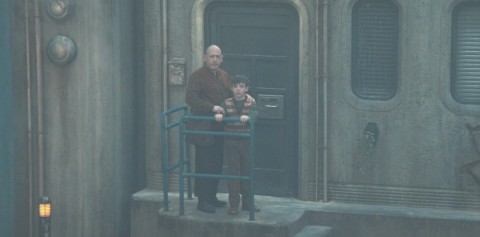 Father and son witnessing horrific fascist style oppression in Silo