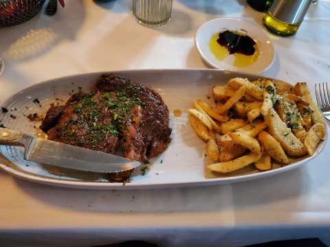 Ribeye with demi-glaze sauce and truffle fries