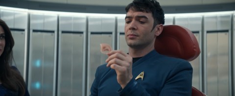 Spock holds a prosthetic Vulcan ear to cover up his human ears