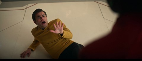 I told you I was not hitting on you! Uhura strikes her hallucination and accidentally hits Jim Kirk